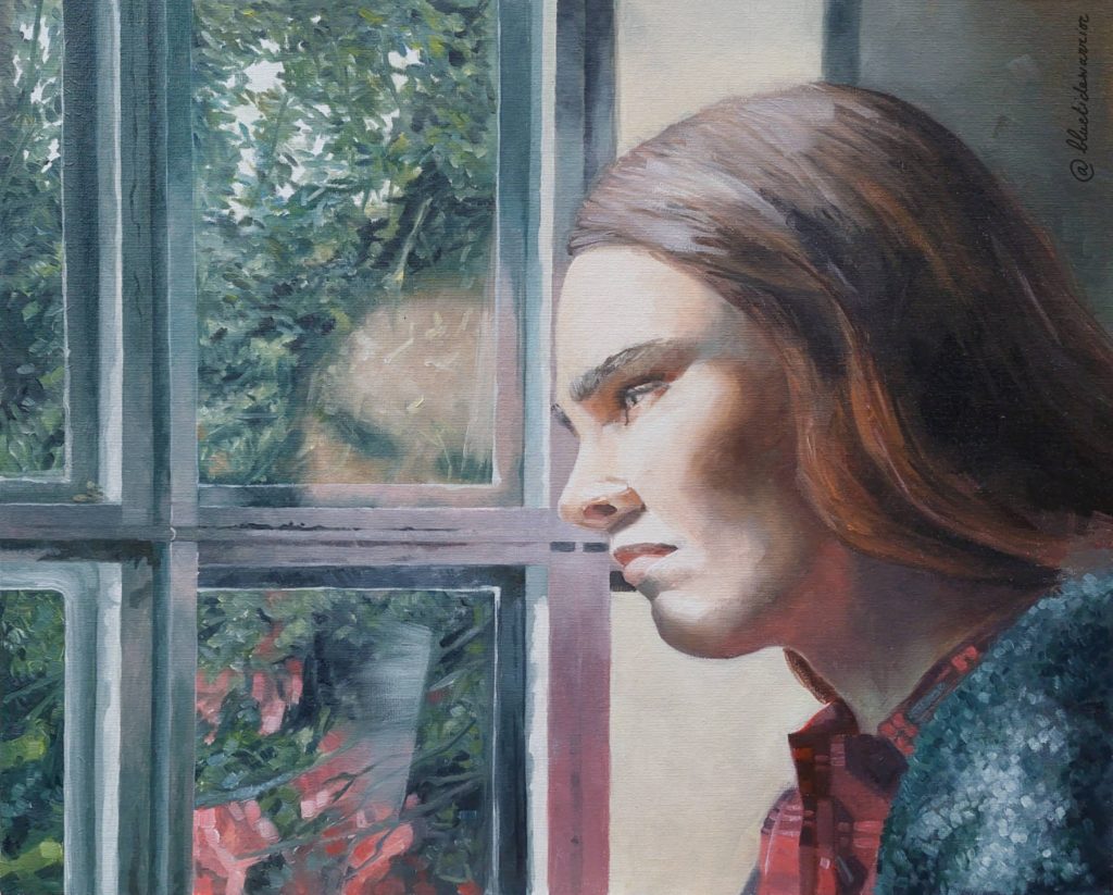 Woman looking through the window.