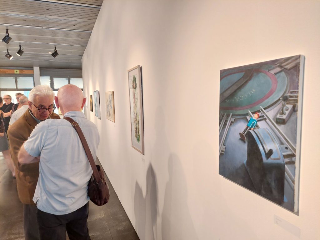 Painting “Rust”, displayed in a row of paintings.